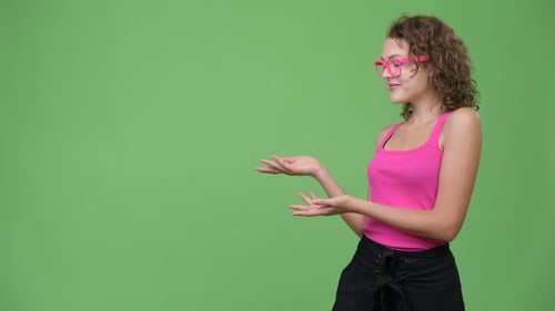 Woman Presenting to the Left on Green Screen