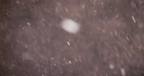 Abstract Sparkles Glittering Against a Dark Background