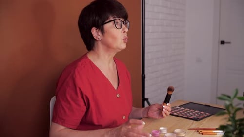 Attractive Aged Female Blogger Does Make Up Reviews Beauty Product for Video Blog Gives Advice to