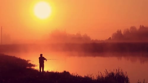 Fisherman Throws Spinning for Fishing. Morning on the Lake