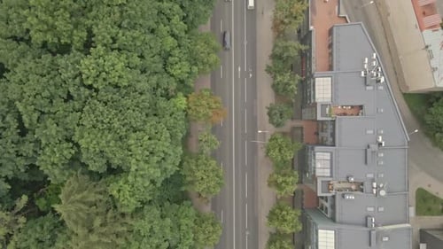 Aerial View of Cars Driving on City Road