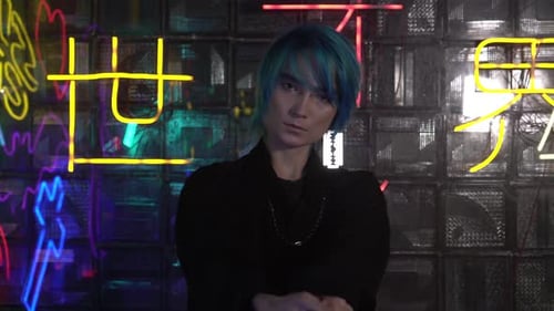 Stylish Young Adult with Baseball Bat in Neon Setting