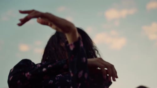 Woman Dancing Outdoors in the Evening Light