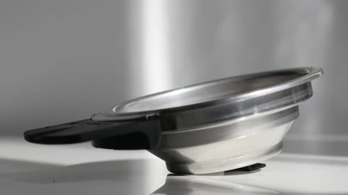 Coffee Grounds Poured into Stainless Steel Espresso Filter