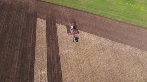 Tractors Preparing Field on Farm