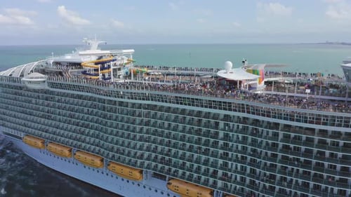 Aerial Top View of Sailing Cruise Ship. Passengers Having Fun on Upper Deck