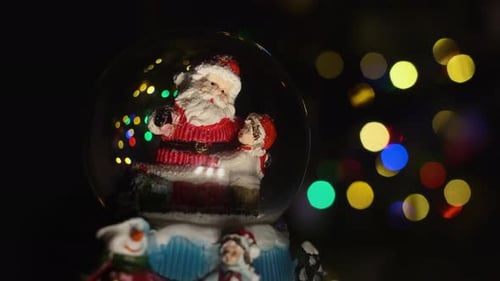 Christmas Magic Ball With Santa And The Boy Inside.