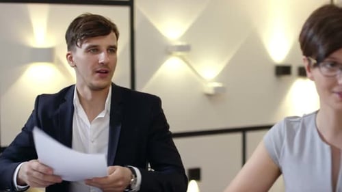 Young Manager at Meeting with Partners