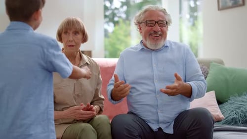 Family Love: Grandparents Embracing Grandchildren at Home