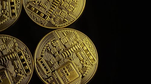 Rotating shot of Bitcoins (digital cryptocurrency) - BITCOIN