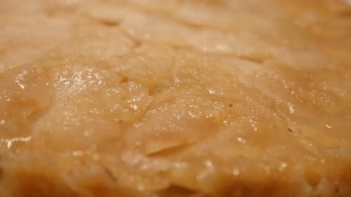 Tasty apple pie in baking tray close-up 4K 2160p 30fps UltraHD tilting footage - Slow tilt over ser
