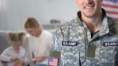 Smiling Soldier Wearing Uniform With Family