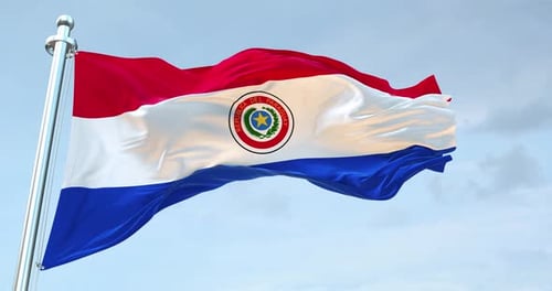 Realistic Paraguay Flag Waving on a Pole Against Blue Sky