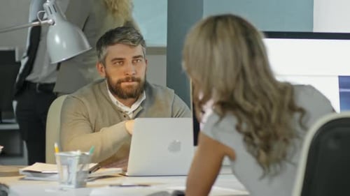 Businesspeople Chatting while Working