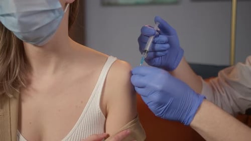 Female Doctor Vaccination Process Making Covid 19 Coronavirus Vaccine at Home or Hospital Safe