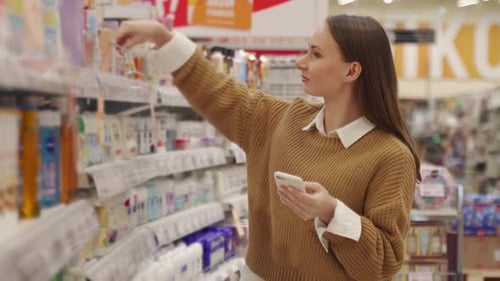 Young Woman Shopping at Cosmetics and Makeup Shop