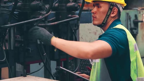 Smart Factory Worker Using Machine in Factory Workshop