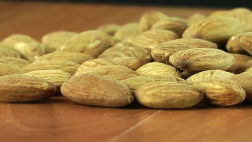 Close-up of Delicious Almonds on Brown Surface