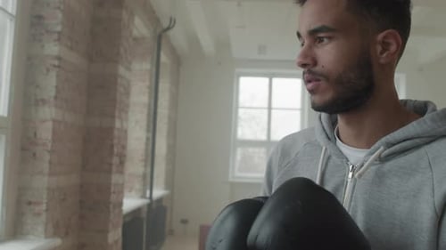 Young Adult Boxing in an Urban Gym Setting