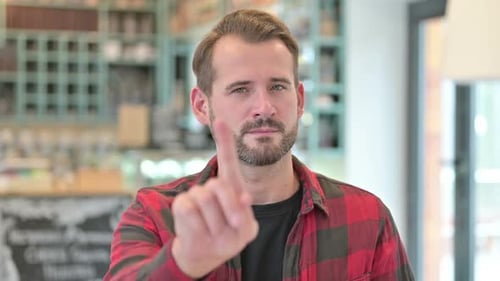 Portrait of No Gesture with Finger By Young Man