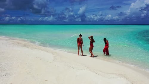 Beautiful fun women on vacation spending quality time at the beach on paradise white sand and blue 4