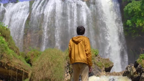 Man Tourist Visits the Elephant Waterfall in the City of Dalat in the Southern Part of Vietnam