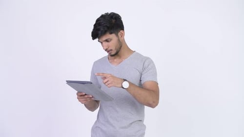Young Man Disappointed Using Tablet Device