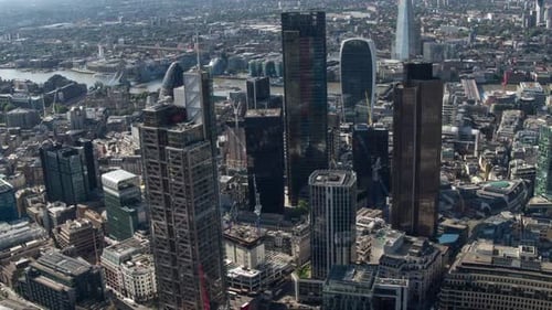 london city aerial helicopter flight urban skyline financial banking