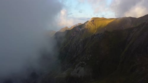 Aerial View of Mountain Peaks in Golden Sunlight