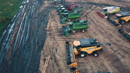 Many Combine Harvesters In A Agricultural Field Aerial View