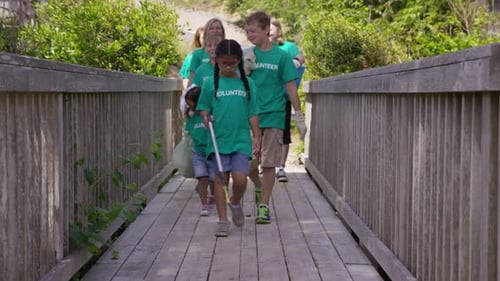Group of volunteers cleaning up park
