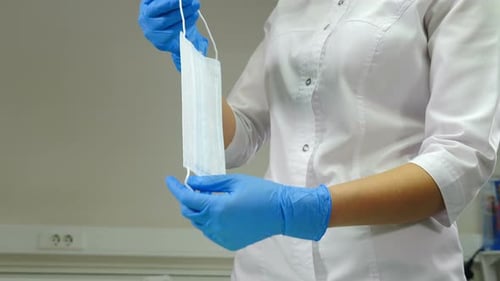Doctor with Mask in White Lab Coat