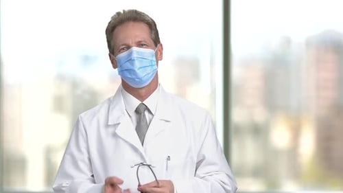 Confident Doctor with Stethoscope and Protective Face Mask