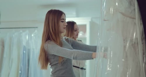Women Shopping for Wedding Dresses in Bridal Shop