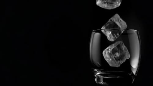 Ice Cubes Falling into a Glass