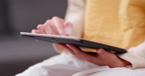 Person Uses a Tablet in a Close Up