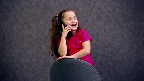 Young Girl Talking on Phone in Studio