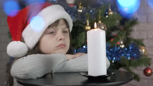 Upset Child in Santa Hat