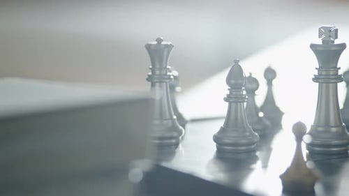 dolly shot of close up chess board game business strategy ideas concept with blur bokeh background