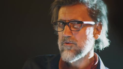 Adult Man Talking in Close-Up Studio Shot