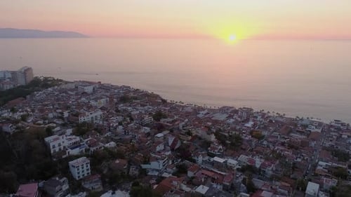 Aerial View of Coastal City at Sunrise