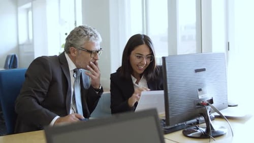 Focused Female Manager Discussing Project with CEO