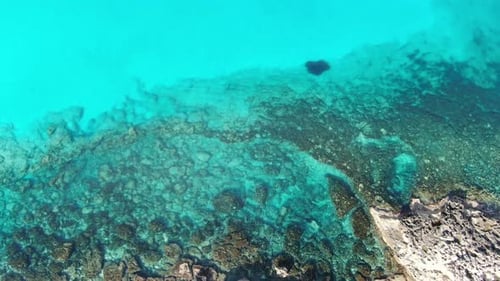 Drone View of Transparent Turquoise Mediterranean Sea with Rocky Coast. Aerial View of Crystal Clear