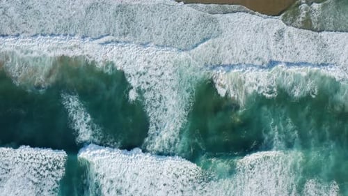 Dramatic Waves Washing Sandy Beach As Seen From Above