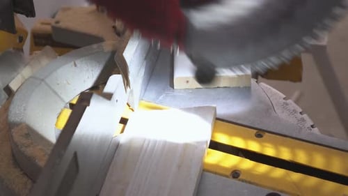 Miter Saw Cutting Wood in Close Up