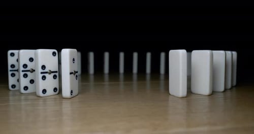 Dominoes Fall in a Domino Effect
