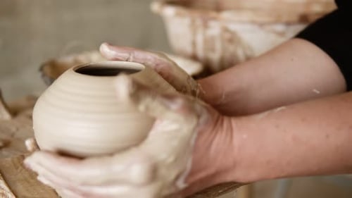 The Female Potter Finished Making a Clay Vase Remove It From the Potter's Wheel