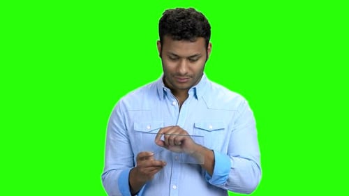Man Interacting with Transparent Tablet Device