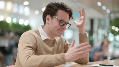 Young Adult Talking and Using Hand Gestures