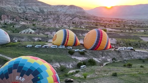 4K Aerial view of Goreme. Colorful hot air balloons fly over the valleys.